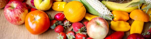 Fresh produce is laid out on table.