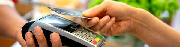 Student purchases grocery with a credit card.